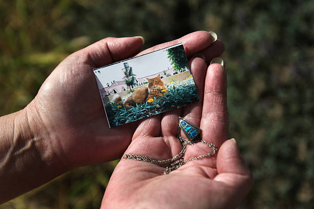 a necklace pendant containing ashes from of her deceased pet